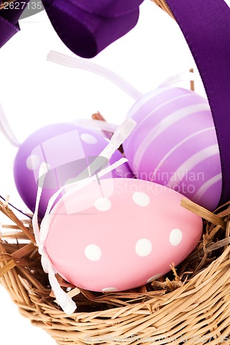 Image of Straw basket with traditional Easter eggs