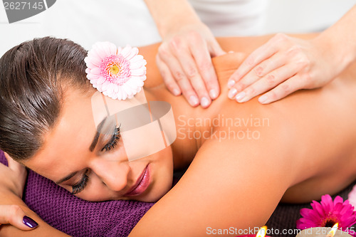 Image of Beautiful woman having a back massage