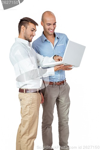 Image of Two businessmen consulting a laptop