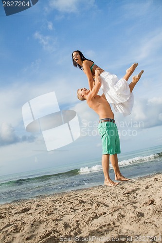 Image of smiling young couple having fun in summer holiday