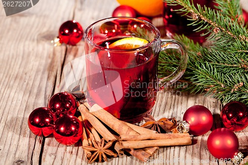 Image of hot tasty spicy mulled red wine with orange and cinnamon christmas 