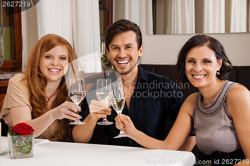 Image of smiling happy people friends in restaurant