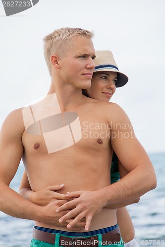 Image of smiling young couple having fun in summer holiday