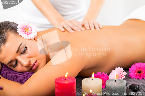 Image of Beautiful woman having a back massage