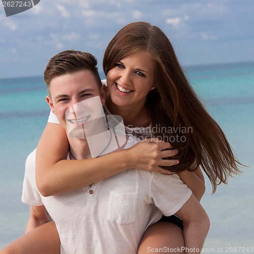 Image of smiling young couple having fun in summer holiday