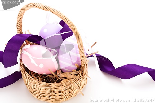 Image of Straw basket with traditional Easter eggs