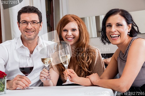 Image of smiling happy people friends in restaurant