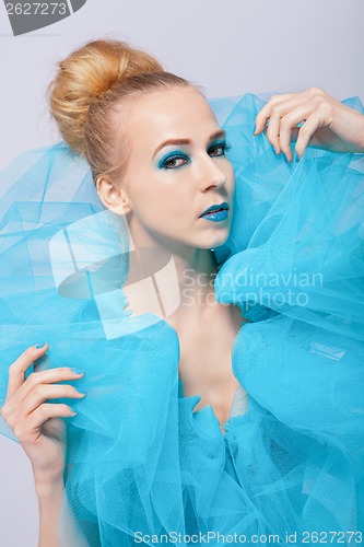 Image of Elegant beautiful woman in a blue gauze ruff