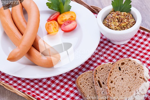 Image of tasty sausages frankfurter with grain bread 