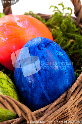 Image of Basket of brightly coloured Easter Eggs