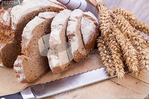 Image of homemade fresh baked bread and knife 