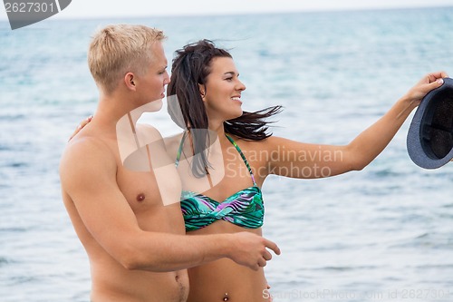 Image of smiling young couple having fun in summer holiday