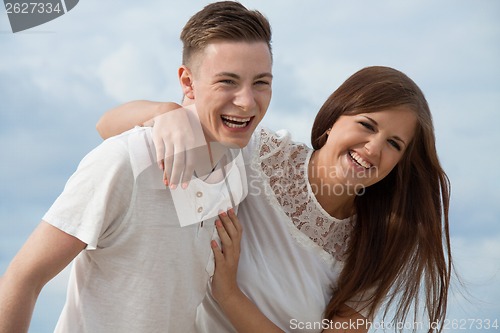 Image of smiling young couple having fun in summer holiday