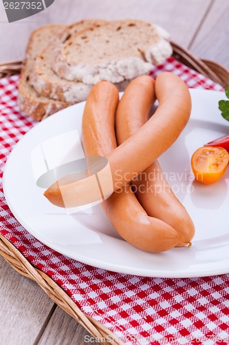 Image of tasty sausages frankfurter with grain bread 