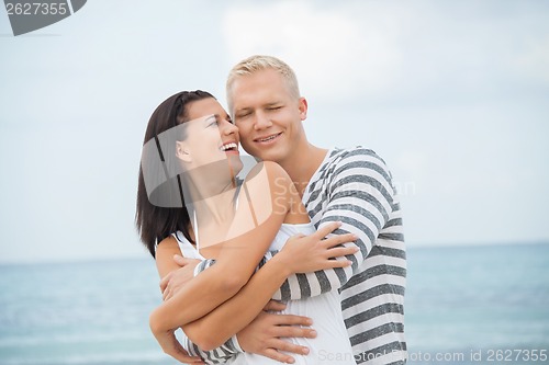 Image of smiling young couple having fun in summer holiday