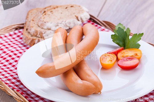 Image of tasty sausages frankfurter with grain bread 