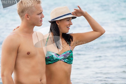 Image of smiling young couple having fun in summer holiday