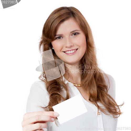 Image of young successful businesswoman with blank business card