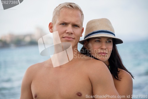 Image of smiling young couple having fun in summer holiday