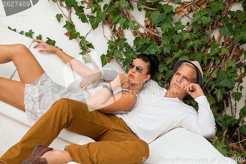 Image of Elegant trendy young couple