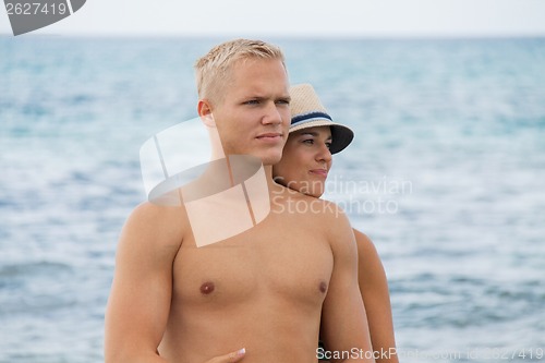 Image of smiling young couple having fun in summer holiday