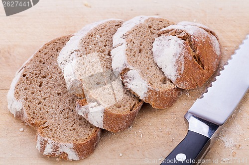 Image of homemade fresh baked bread and knife 