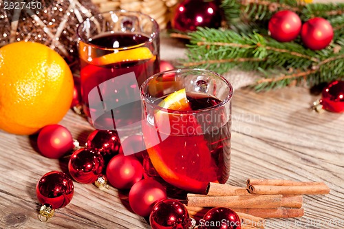 Image of hot tasty spicy mulled red wine with orange and cinnamon christmas 