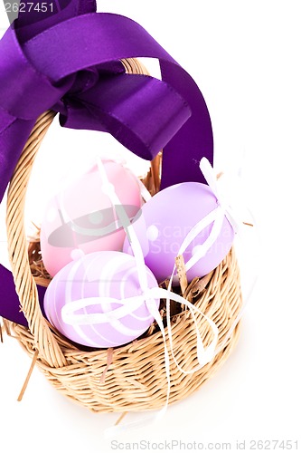 Image of Straw basket with traditional Easter eggs