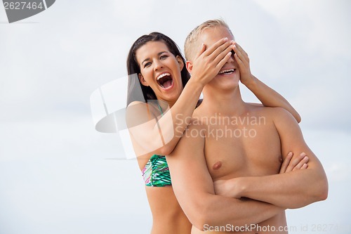 Image of smiling young couple having fun in summer holiday