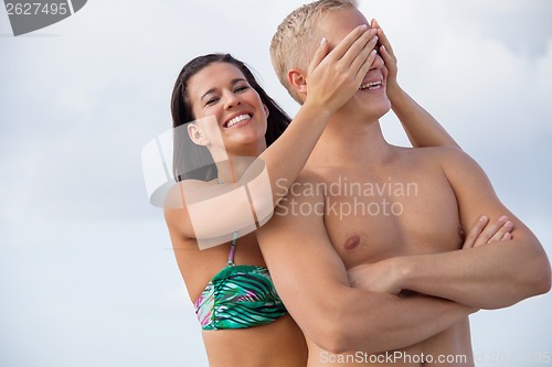 Image of smiling young couple having fun in summer holiday