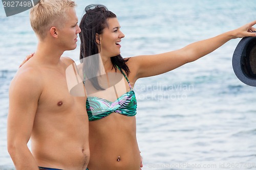 Image of smiling young couple having fun in summer holiday