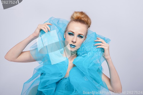 Image of Elegant beautiful woman in a blue gauze ruff