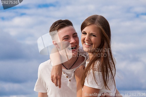 Image of smiling young couple having fun in summer holiday