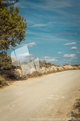 Image of empty road in sunlight blue sky destination