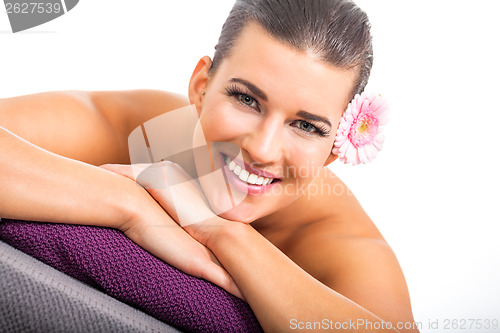 Image of young attractive woman hot stone massage wellness