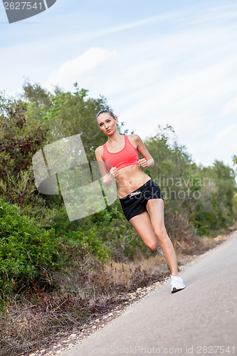 Image of young athletic woman runner jogger outdoor