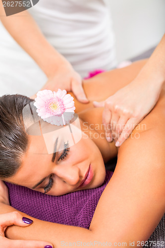 Image of Beautiful woman having a back massage