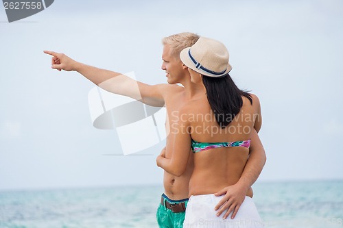 Image of smiling young couple having fun in summer holiday