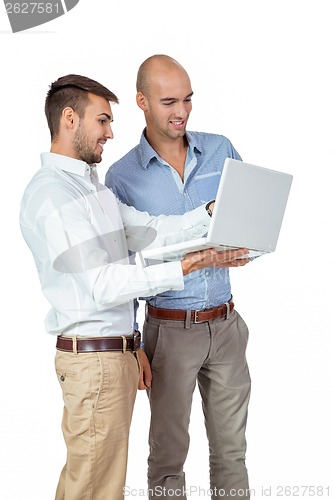 Image of Two businessmen consulting a laptop