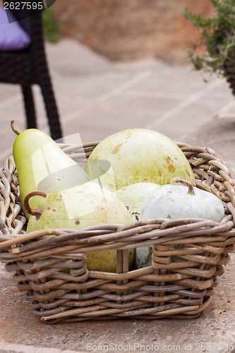Image of Fresh ripe pears in a wicker basket