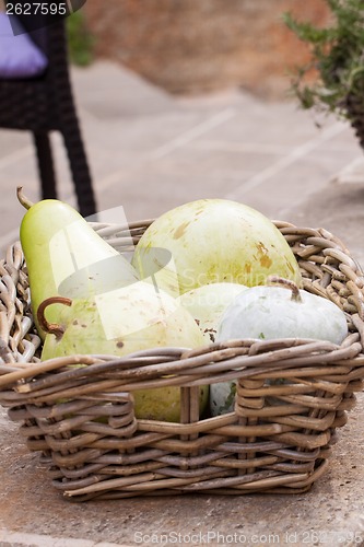 Image of Fresh ripe pears in a wicker basket