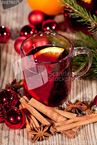 Image of hot tasty spicy mulled red wine with orange and cinnamon christmas 