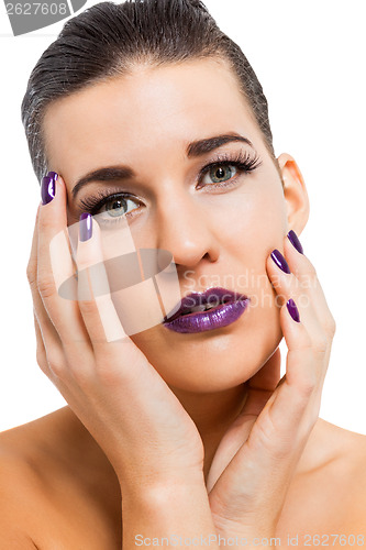 Image of Graceful attractive woman with purple lips and nails