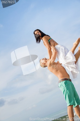 Image of smiling young couple having fun in summer holiday