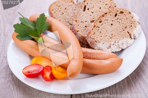 Image of tasty sausages frankfurter with grain bread 