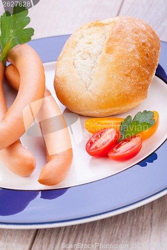 Image of tasty sausages frankfurter with grain bread 