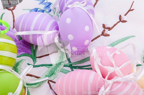 Image of colorful easter egg decoration on wooden background