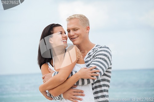 Image of smiling young couple having fun in summer holiday