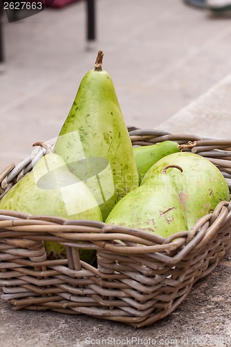 Image of Fresh ripe pears in a wicker basket