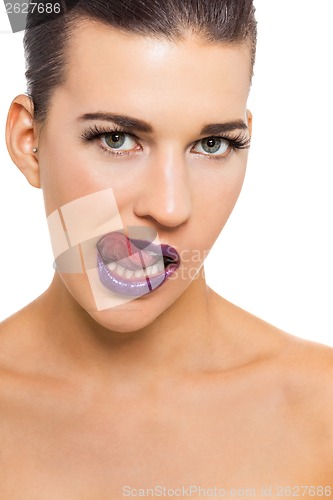 Image of Graceful attractive woman with purple lips and nails